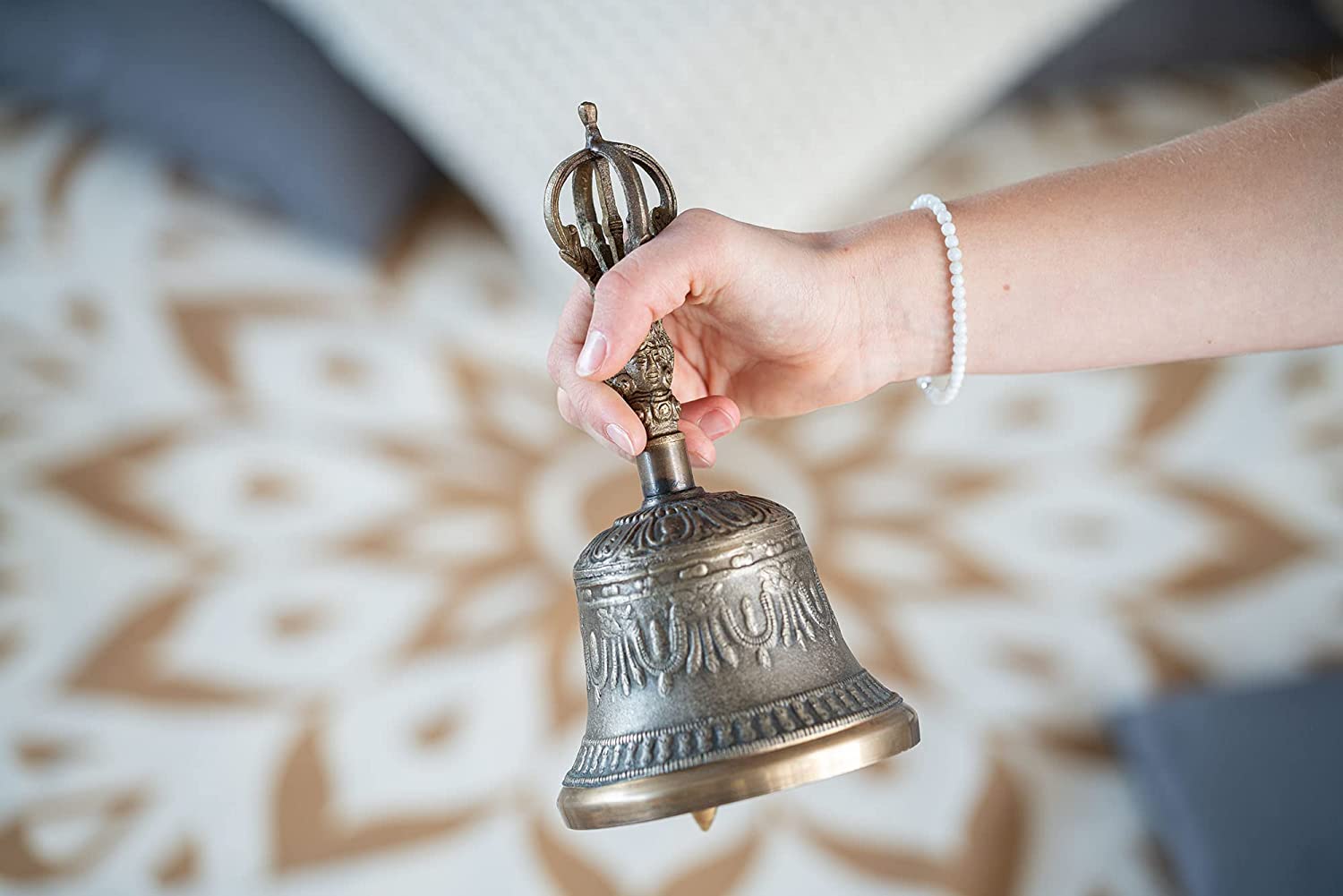 Buddhist Meditation Bell held in hand